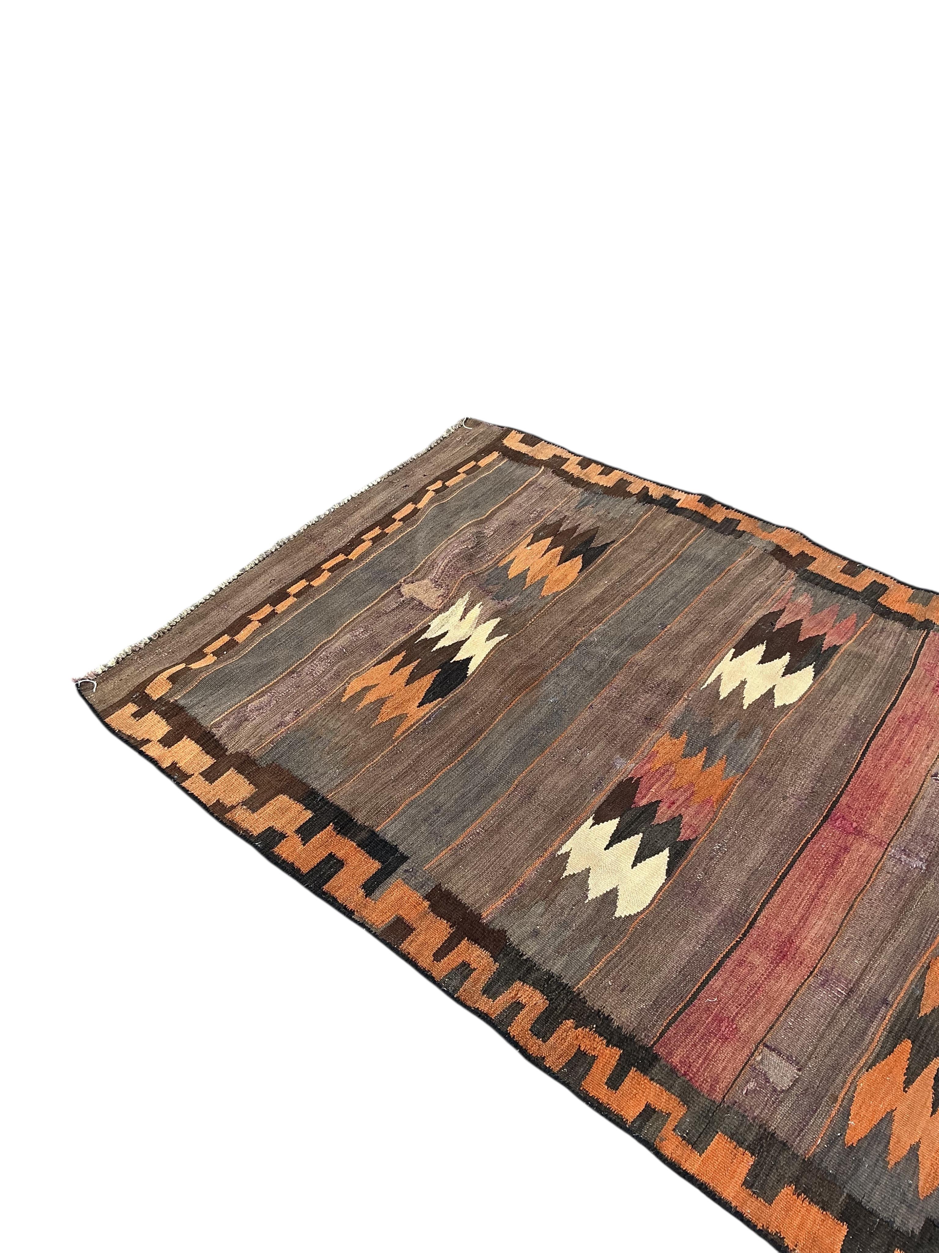 A Turkish kilim flat weave hall carpet, 280 x 120cm